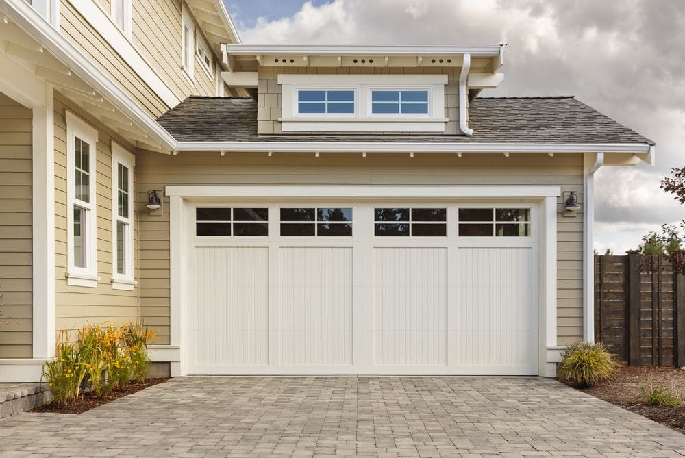 Modern suburban house with a stylish white garage door