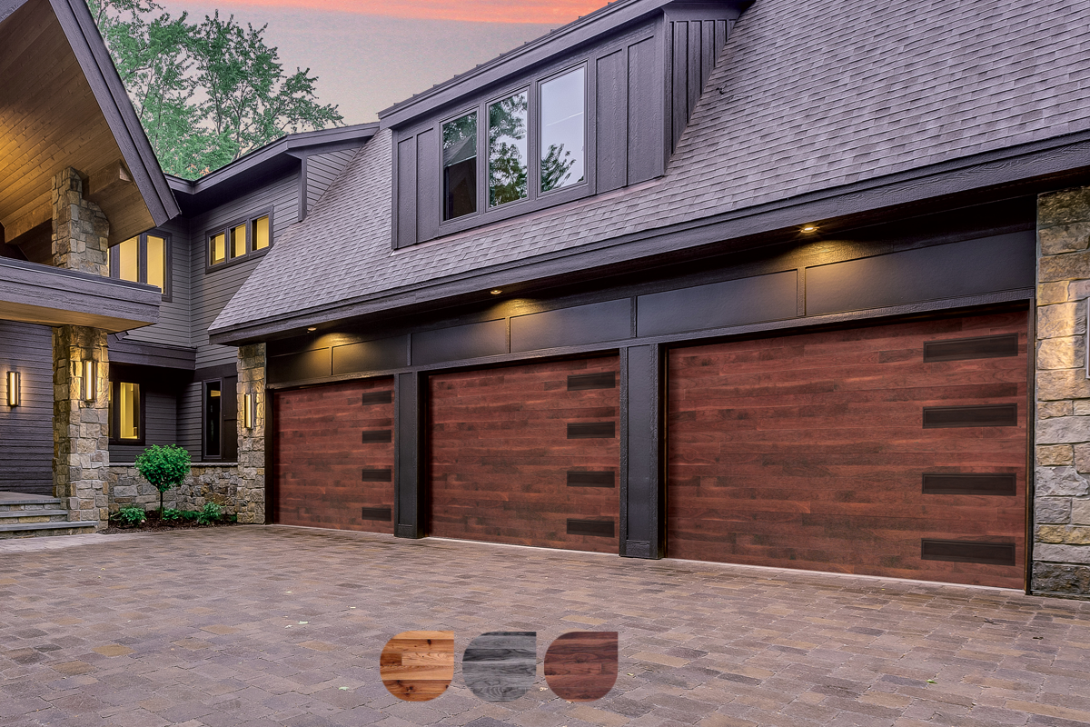 Modern home with three elegant wooden garage doors at sunset