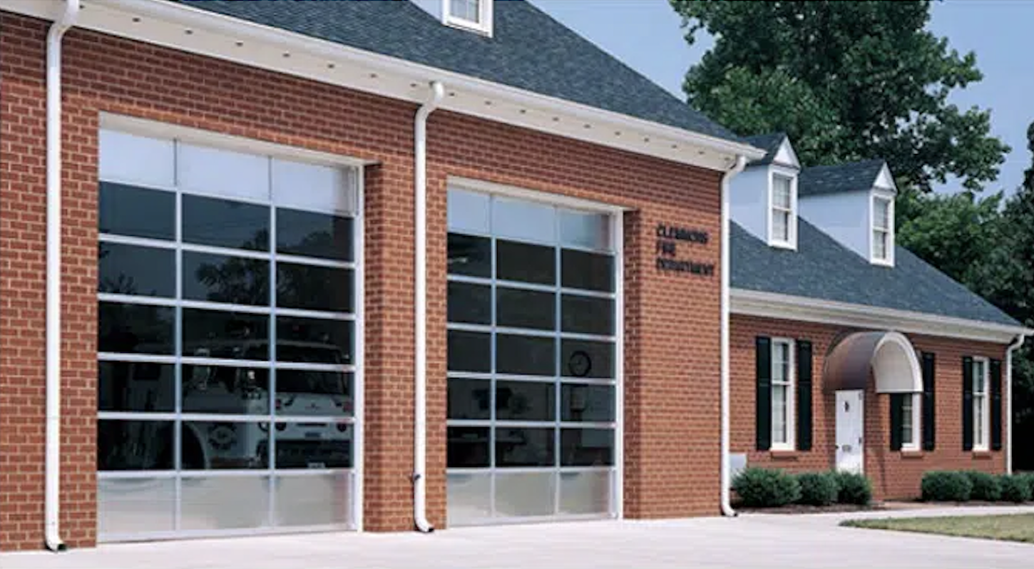 Fire station with large garage doors and brick exterior.